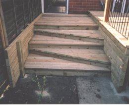 Close-up of steps from deck to garden