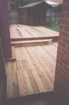 long deck following a decorative outside wall 