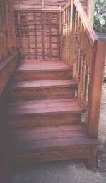 Close-up of steps from deck to garden